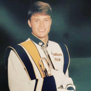 R.K. Slade as a young trumpet player in a Georgia Southern University marching band uniform in the 1990s.